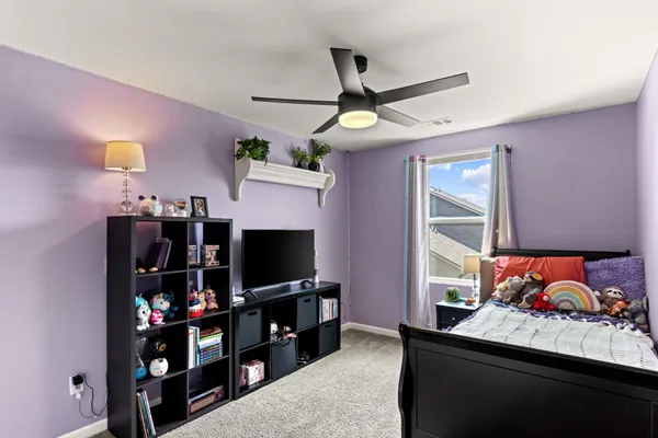 a room with lots of different colored cloths