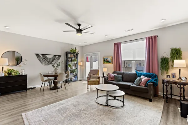 a living room with furniture and a large window
