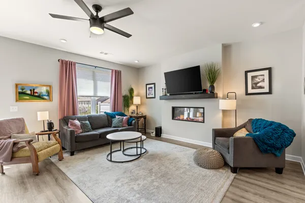 a living room with furniture and a flat screen tv