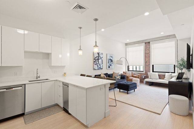 a open kitchen with stainless steel appliances granite countertop a sink and cabinets