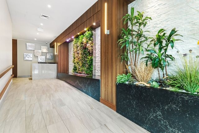 a view of a living room and floor to ceiling window