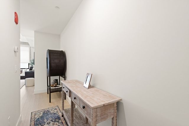 a bedroom with a bed and a chair