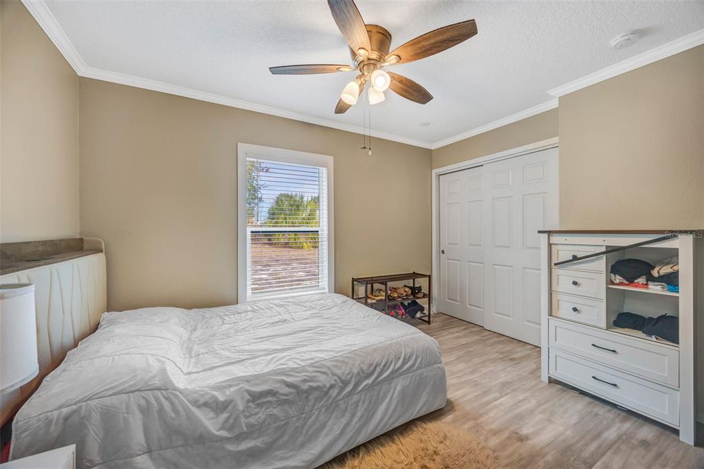 7149 Spruce Drive Weeki Wachee, FL 34607 - Photo 16 of 23 a bedroom with a bed and a closet