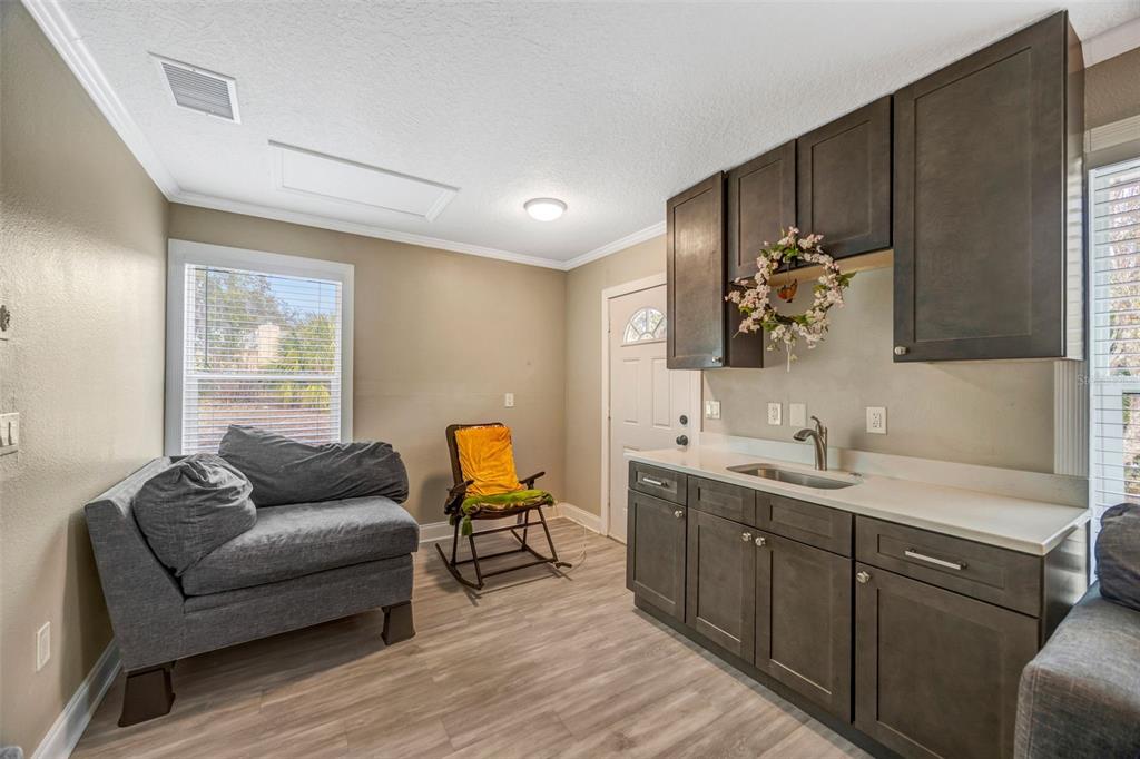7149 Spruce Drive Weeki Wachee, FL 34607 - Photo 17 of 23 a living room with furniture and wooden floor
