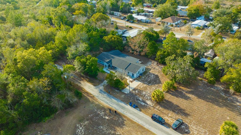 7149 Spruce Drive Weeki Wachee, FL 34607 - Photo 22 of 23 an aerial view of residential houses with outdoor space