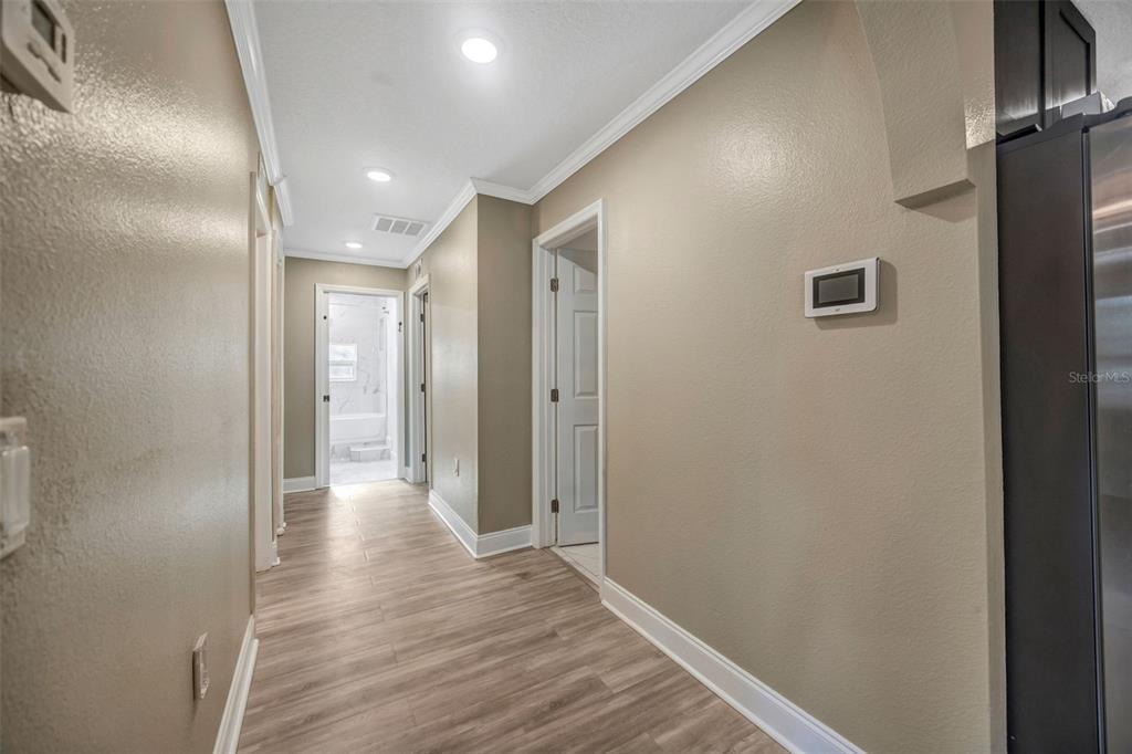 7149 Spruce Drive Weeki Wachee, FL 34607 - Photo 6 of 23 a view of hallway with wooden floor