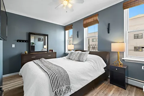a bedroom with a bed and a lamp