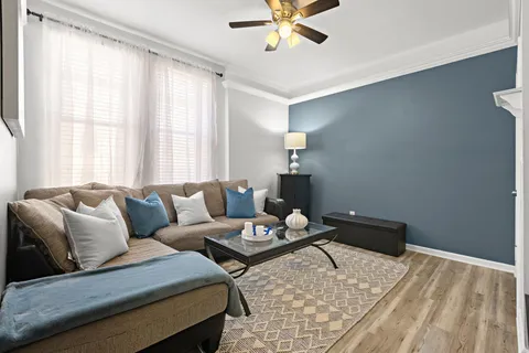 a living room with furniture and a window