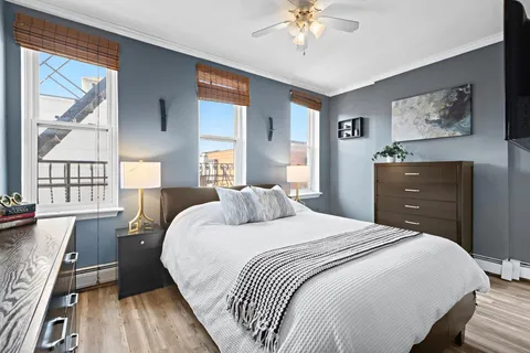 a bedroom with a bed and a dresser