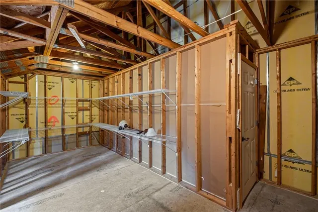 a view of an empty room with wooden walls