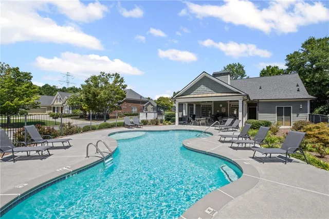 a front view of house with yard and outdoor seating