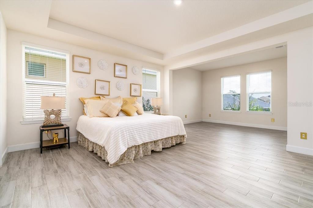 1296 Waterview Ridge Circle Apopka, FL 32703 - Photo 5 of 60 a bed room with a bed and a window
