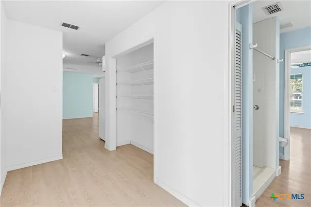 a view of a bathroom with closet