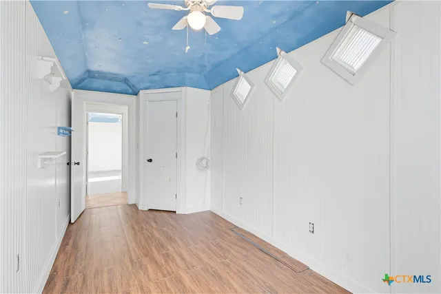 a view of a livingroom with wooden floor