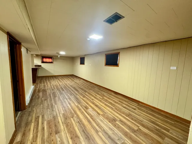 a view of wooden floor in an empty room