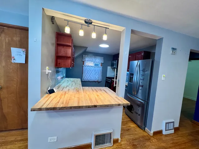 a room with pool table and windows