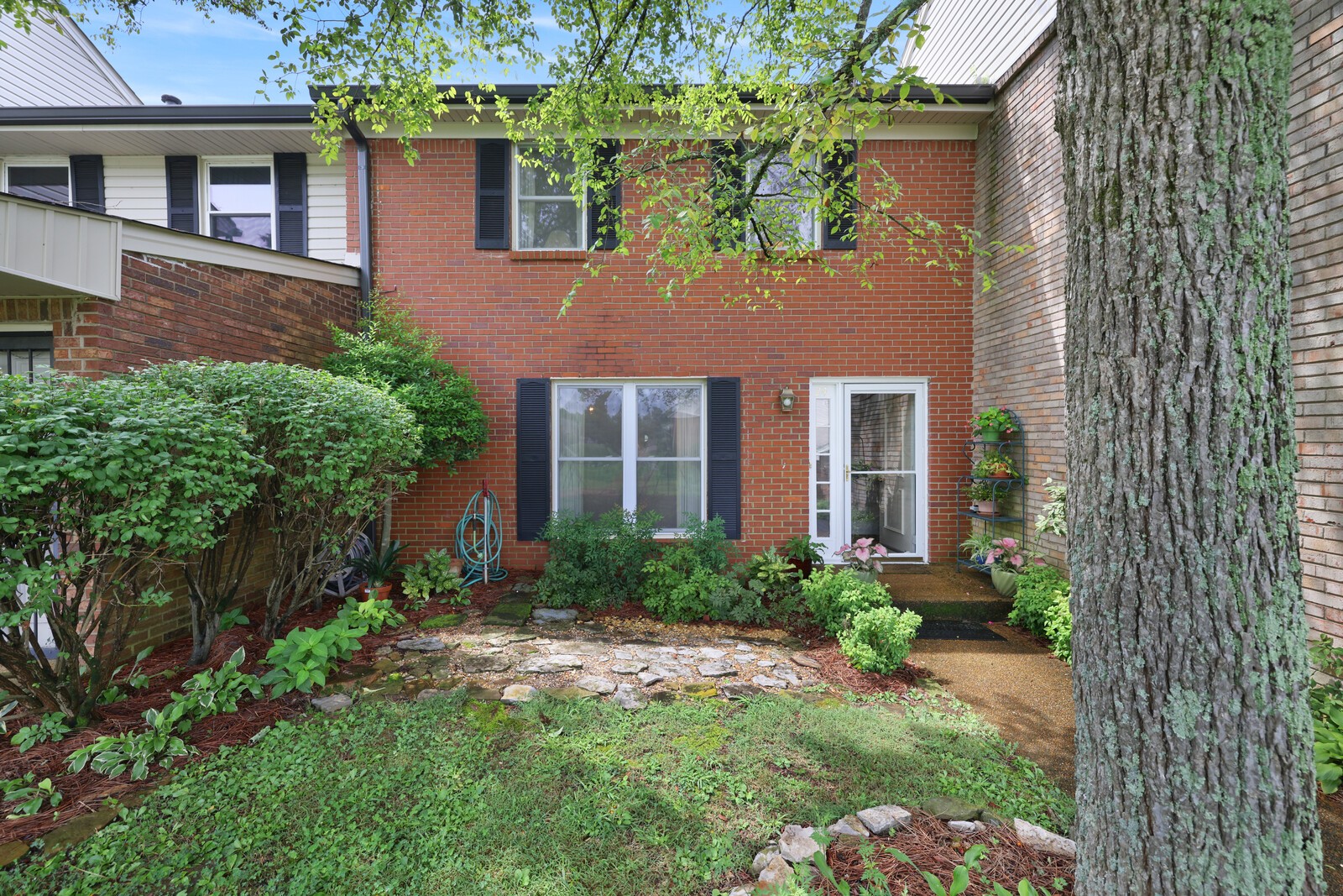 4001 Anderson Road, Unit K24 Nashville, TN 37217 - Photo 1 of 36 front view of a house with a yard