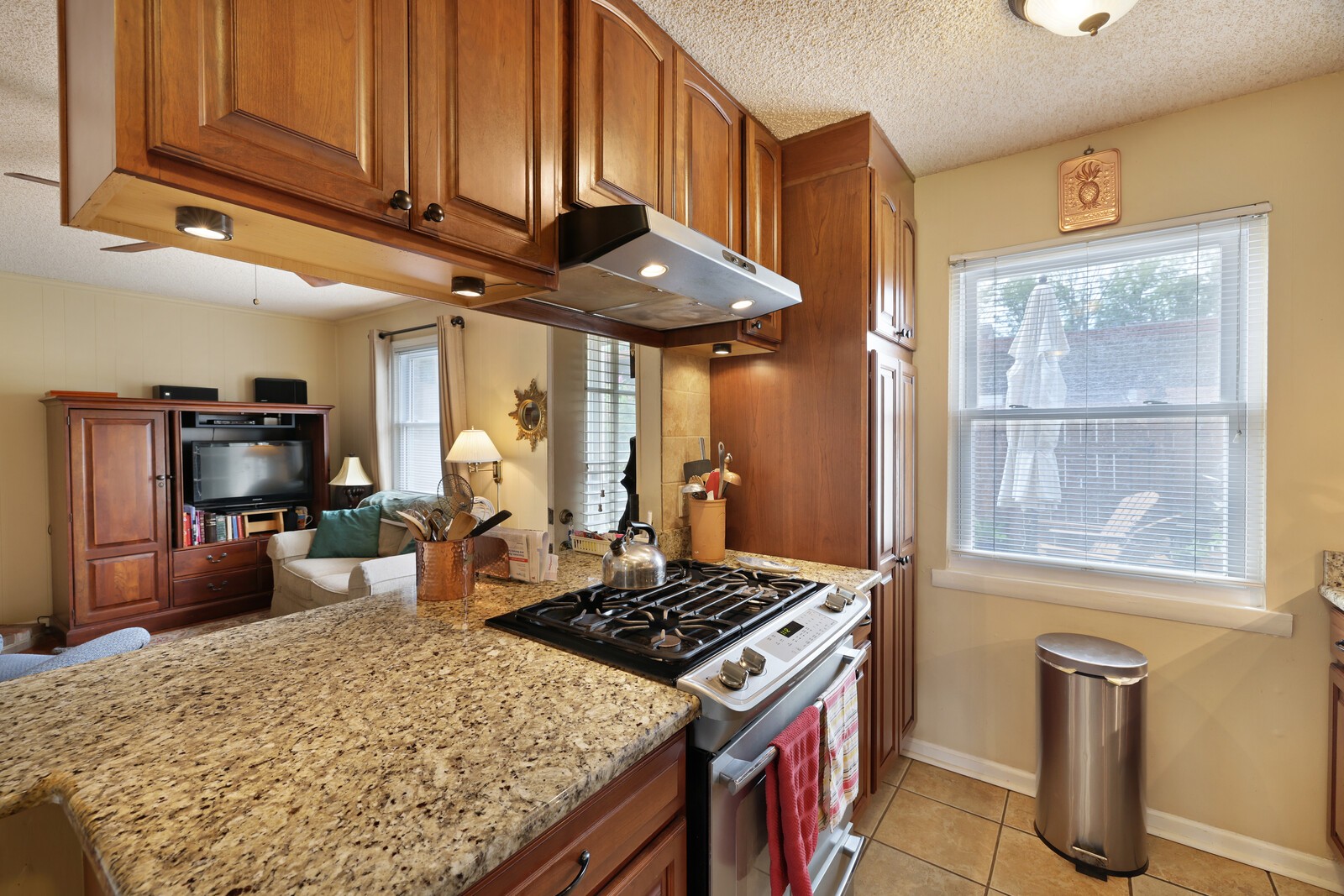 4001 Anderson Road, Unit K24 Nashville, TN 37217 - Photo 12 of 36 a kitchen with a stove and a wooden cabinets