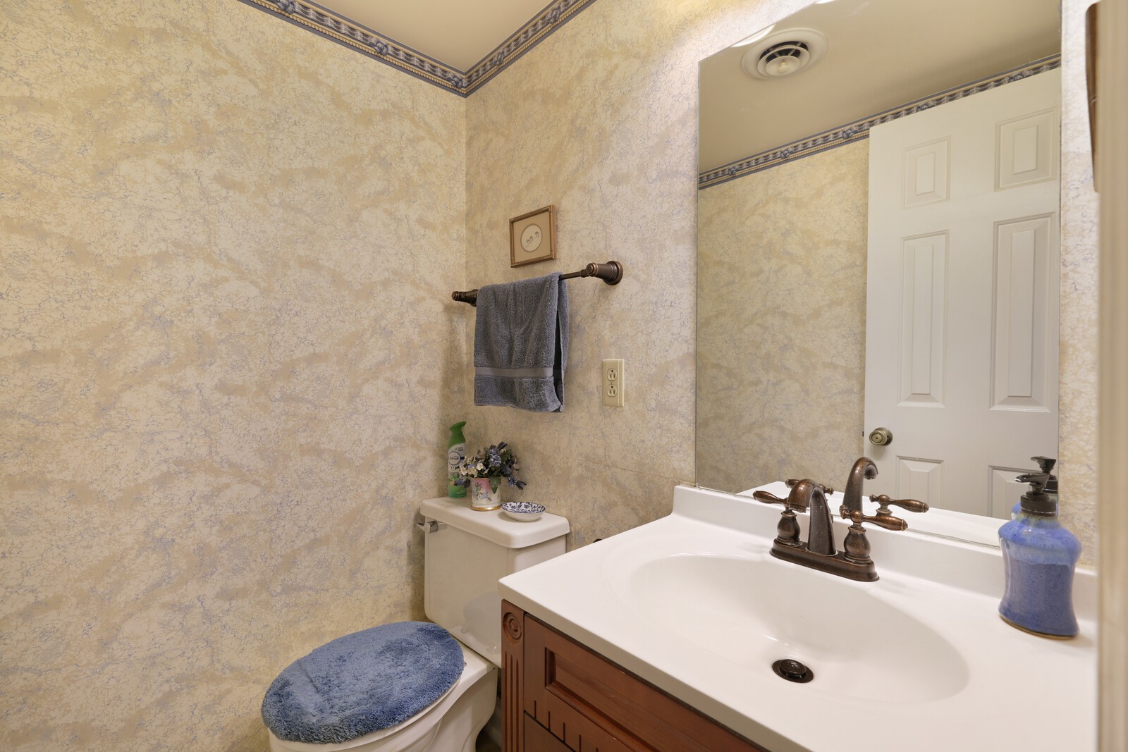 4001 Anderson Road, Unit K24 Nashville, TN 37217 - Photo 15 of 36 a bathroom with a sink a toilet and mirror