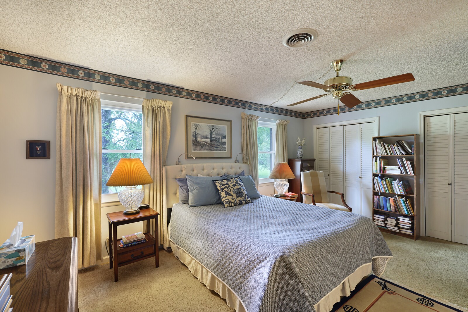 4001 Anderson Road, Unit K24 Nashville, TN 37217 - Photo 17 of 36 a bedroom with a bed and a chandelier