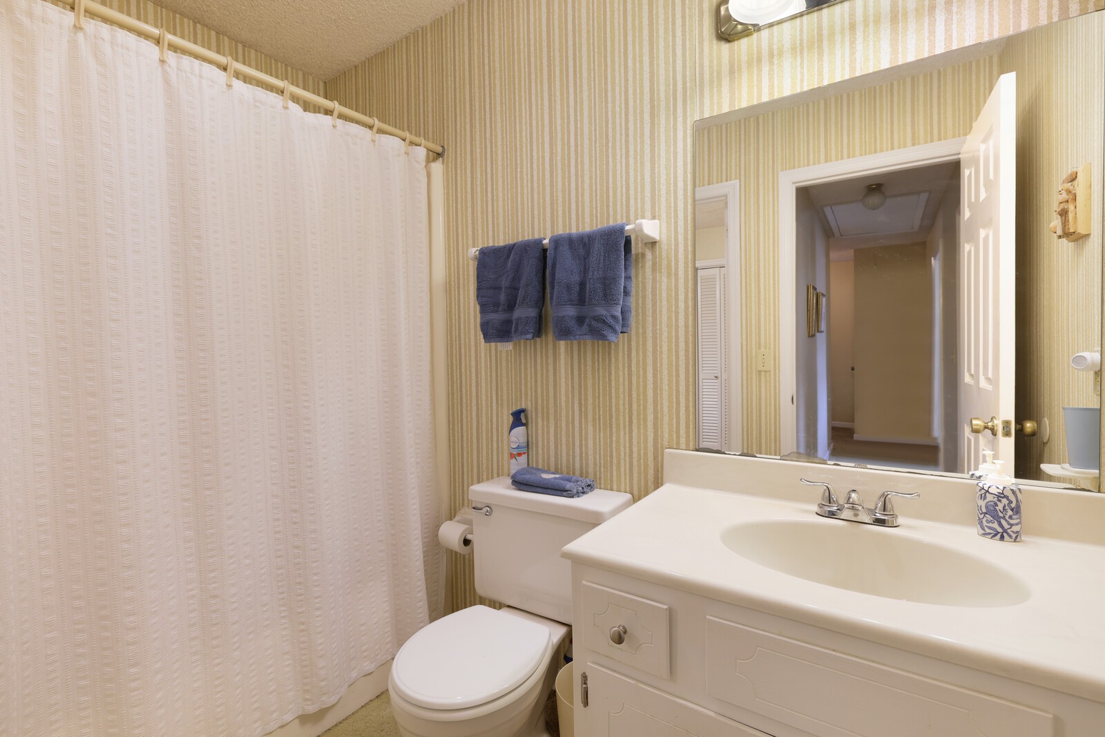 4001 Anderson Road, Unit K24 Nashville, TN 37217 - Photo 21 of 36 a bathroom with a sink a toilet and shower curtain