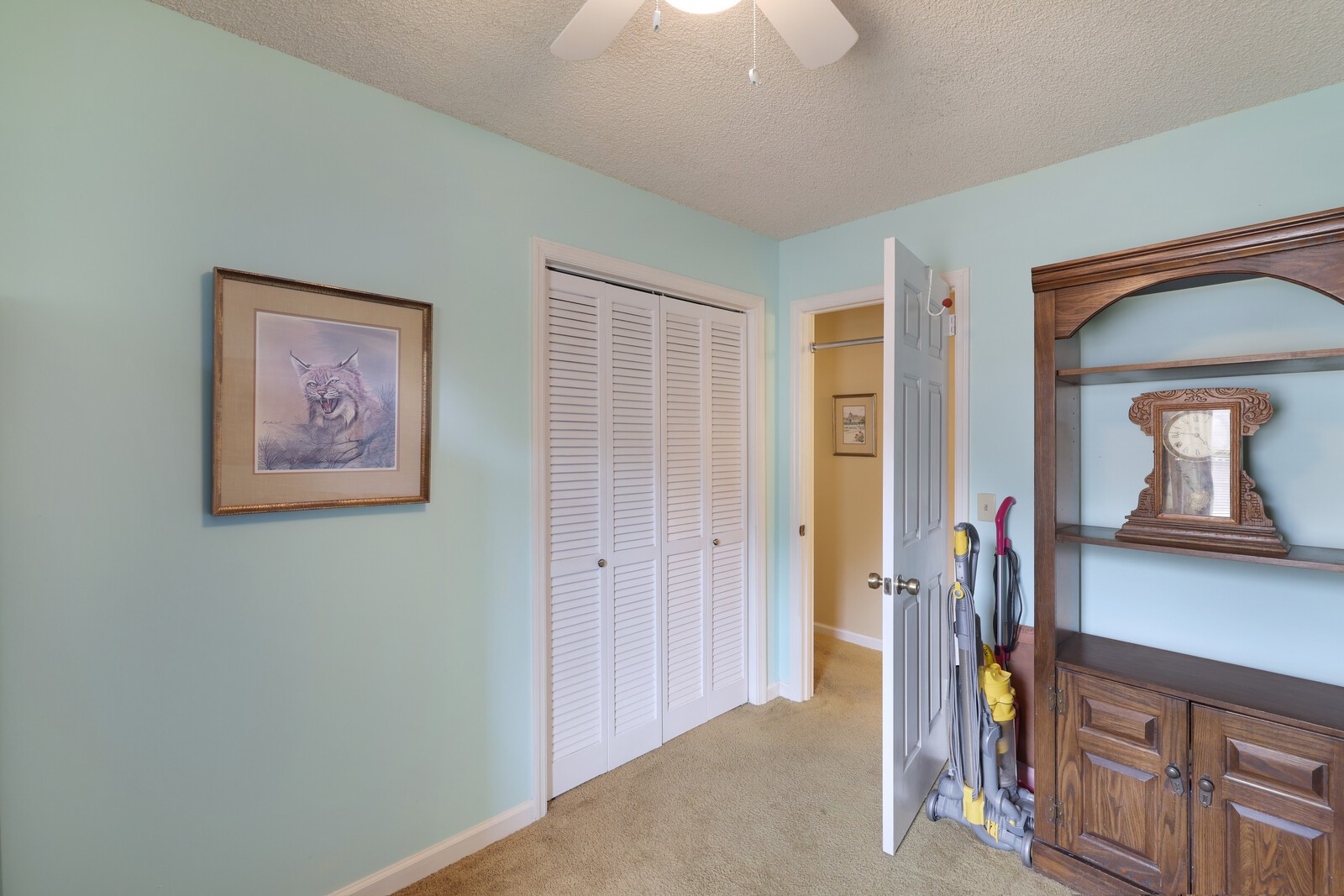 4001 Anderson Road, Unit K24 Nashville, TN 37217 - Photo 23 of 36 a view of a hallway with paintings on the wall