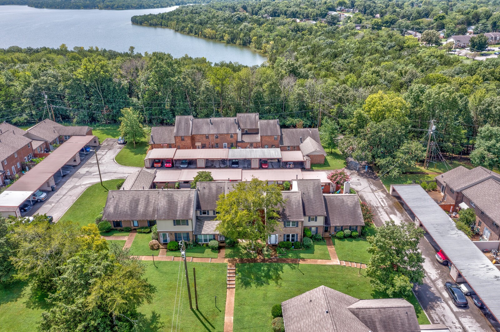 4001 Anderson Road, Unit K24 Nashville, TN 37217 - Photo 35 of 36 an aerial view of a house with a garden and lake view