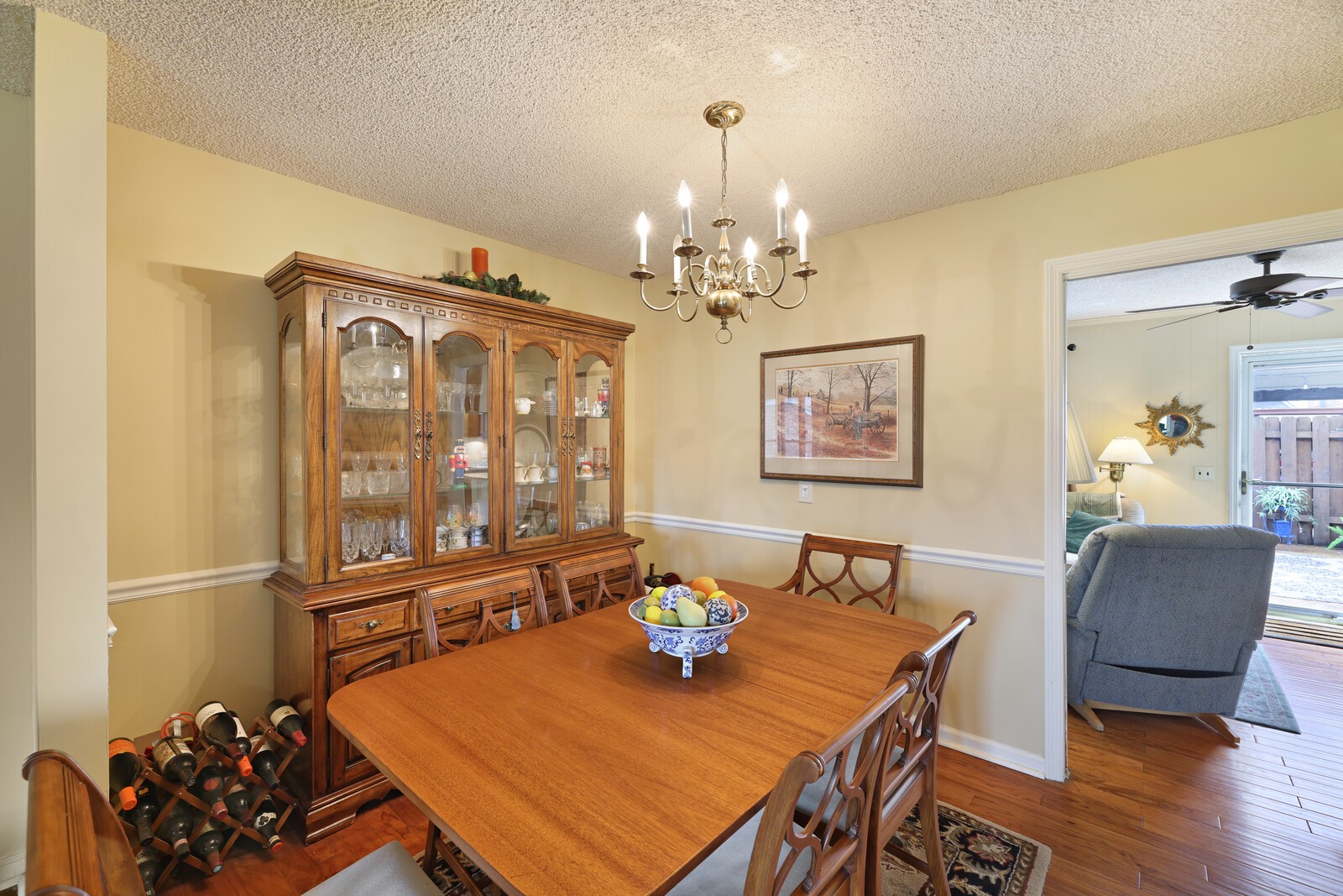 4001 Anderson Road, Unit K24 Nashville, TN 37217 - Photo 9 of 36 a view of a dining room with furniture a chandelier and wooden floor