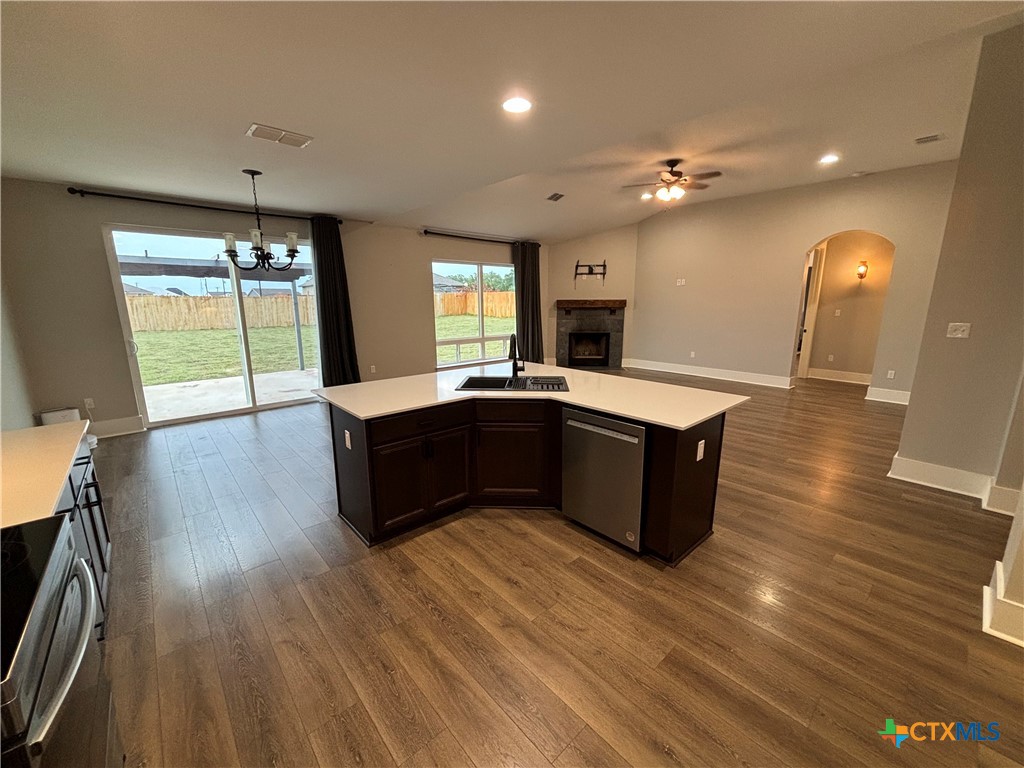110 Hiram Cook Blanco, TX 78606 - Photo 29 of 46 a kitchen with kitchen island granite countertop a sink counter and wooden floor