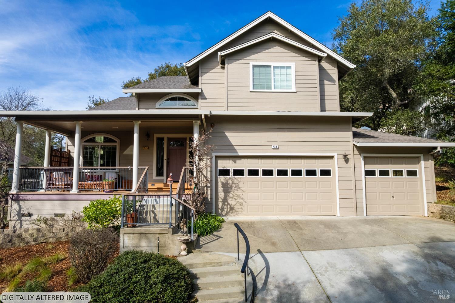 a front view of a house with a yard garage and outdoor seating