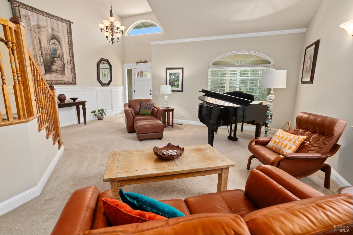 230 Clear Ridge Drive Healdsburg, CA 95448 - Photo 12 of 48 a living room with furniture and a chandelier