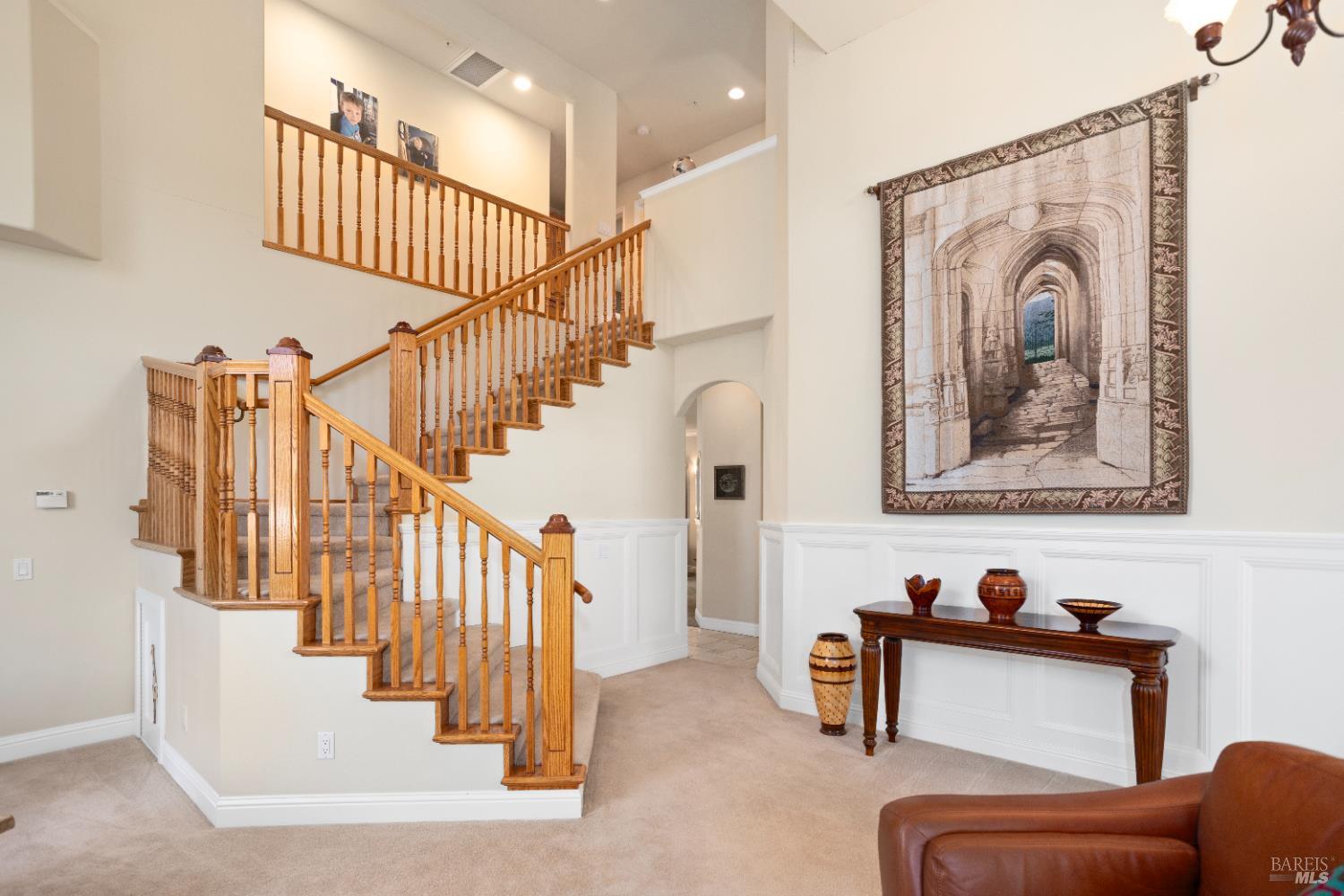 230 Clear Ridge Drive Healdsburg, CA 95448 - Photo 14 of 48 a view of staircase with furniture and lots of frames on wall