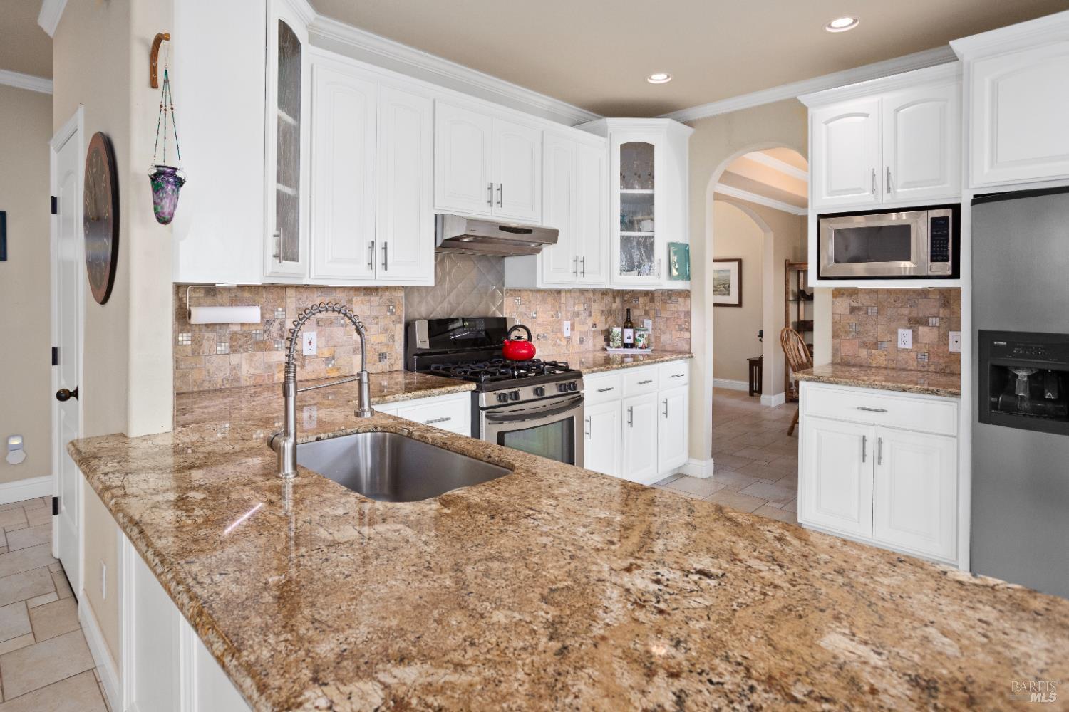 230 Clear Ridge Drive Healdsburg, CA 95448 - Photo 18 of 48 a kitchen with stainless steel appliances granite countertop a sink stove and refrigerator