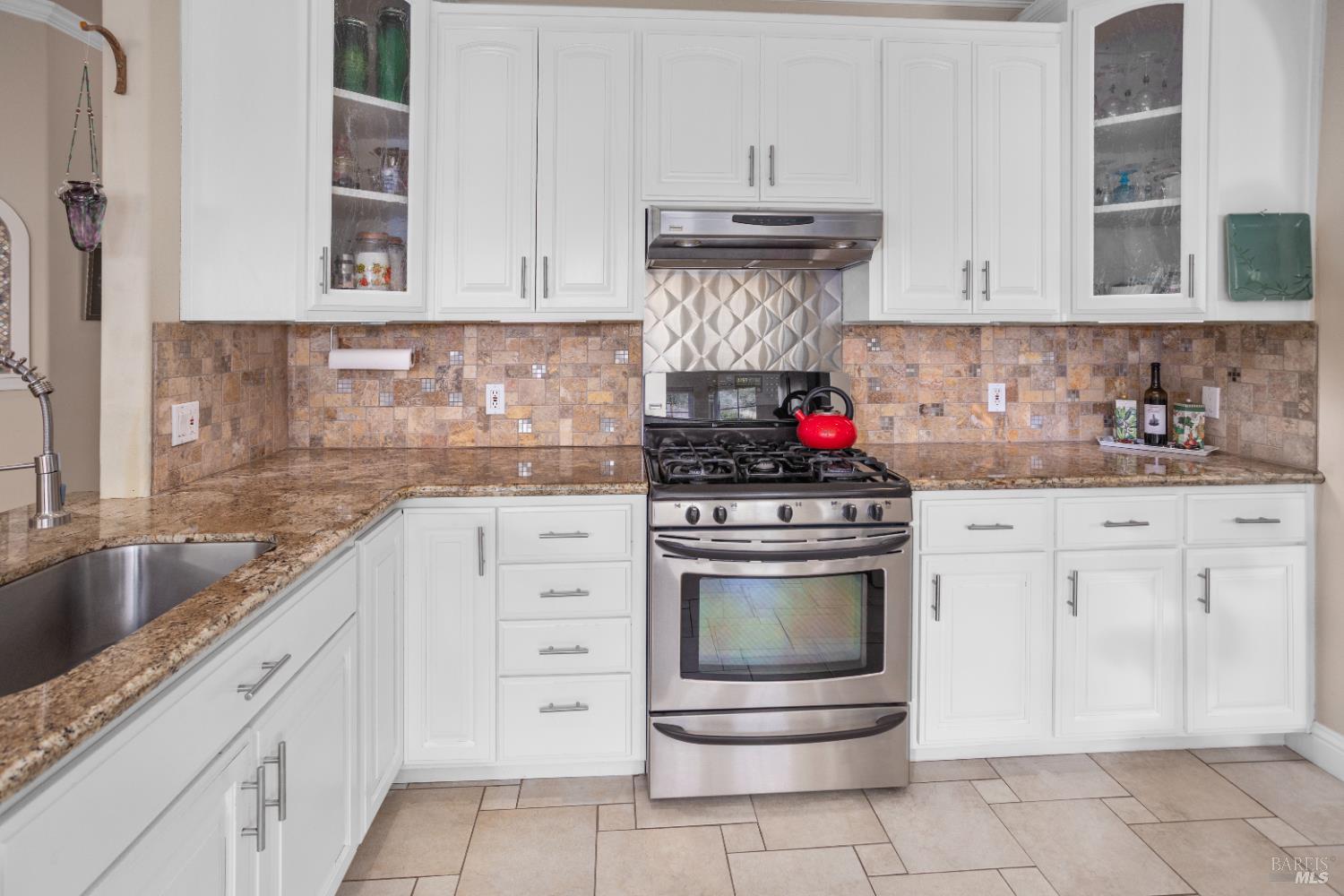 230 Clear Ridge Drive Healdsburg, CA 95448 - Photo 20 of 48 a kitchen with stainless steel appliances granite countertop a stove and a sink