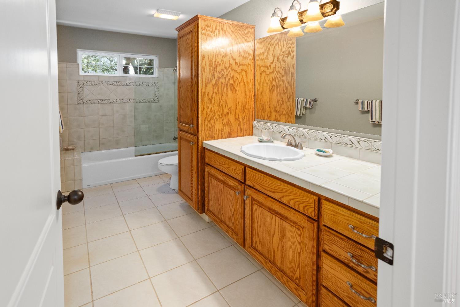 230 Clear Ridge Drive Healdsburg, CA 95448 - Photo 31 of 48 a spacious bathroom with a granite countertop sink a toilet mirror and bathtub