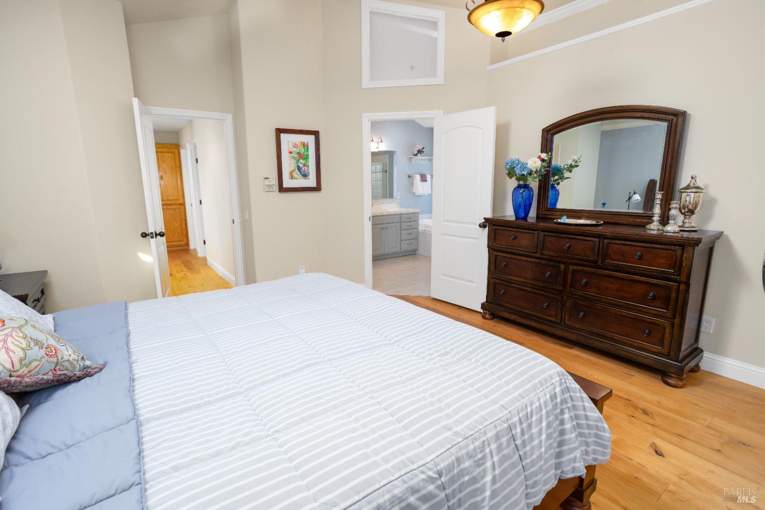 230 Clear Ridge Drive Healdsburg, CA 95448 - Photo 38 of 48 a bedroom with a bed and a mirror on dresser