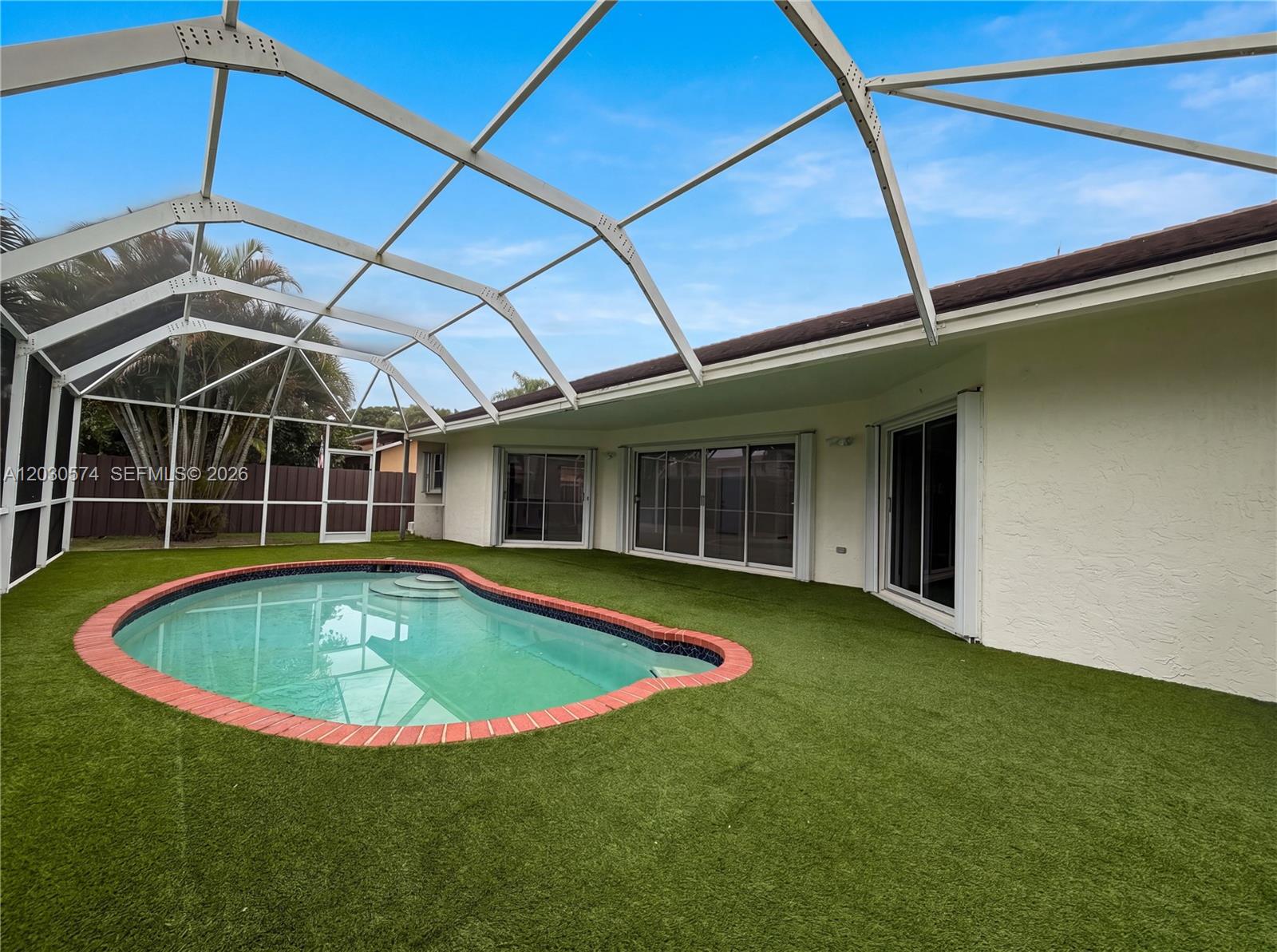 16571 Southwest 145th Avenue Miami, FL 33177 - Photo 24 of 25 a view of a backyard with swimming pool