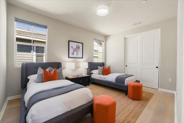 a bedroom with furniture and a window