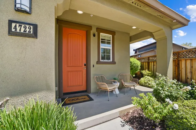 a view of two chairs in the room