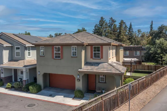 a front view of house with yard and outdoor seating