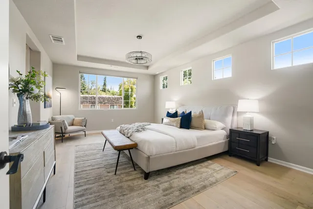 a bedroom with a bed and a couch