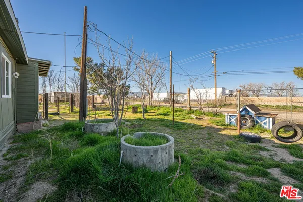 a view of a sink and porch with wooden fence