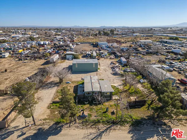 an aerial view of a city with ocean view