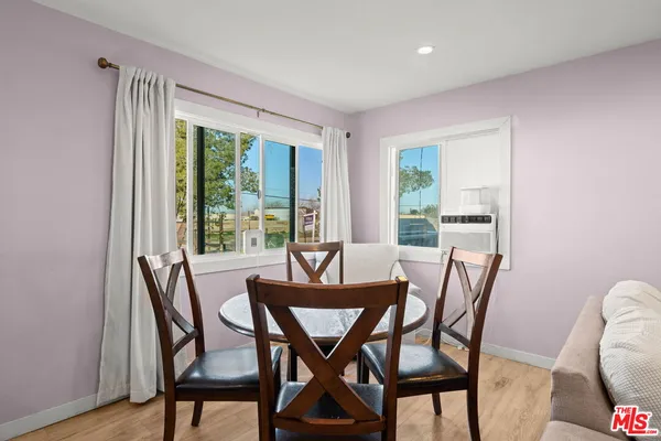 a view of a dining room with furniture window and outside view