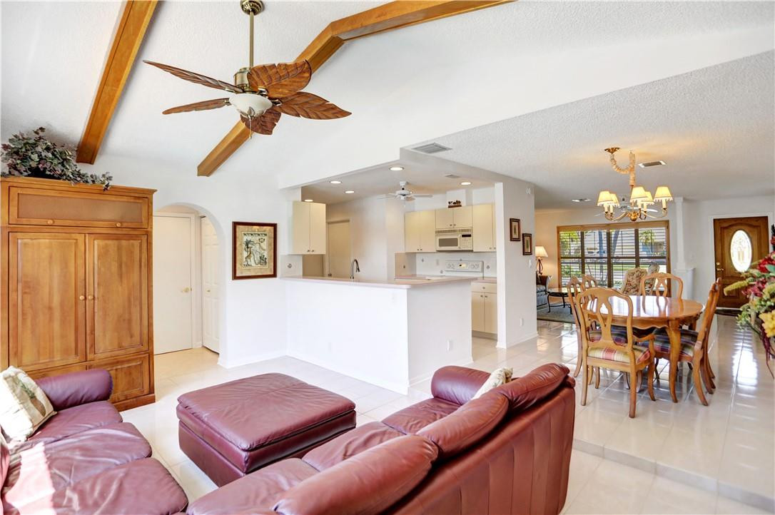 1300 Cormorant Road Delray Beach, FL 33444 - Photo 16 of 68 Family Room, Dining Room, and Kitchen