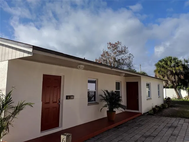 a house with trees in front of it