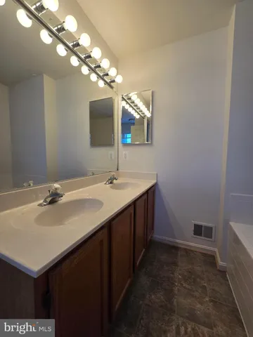 a bathroom with a sink and a toilet