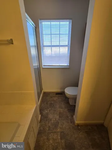 a yard with wooden fence