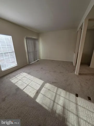 a view of a kitchen with a refrigerator a sink and a dishwasher