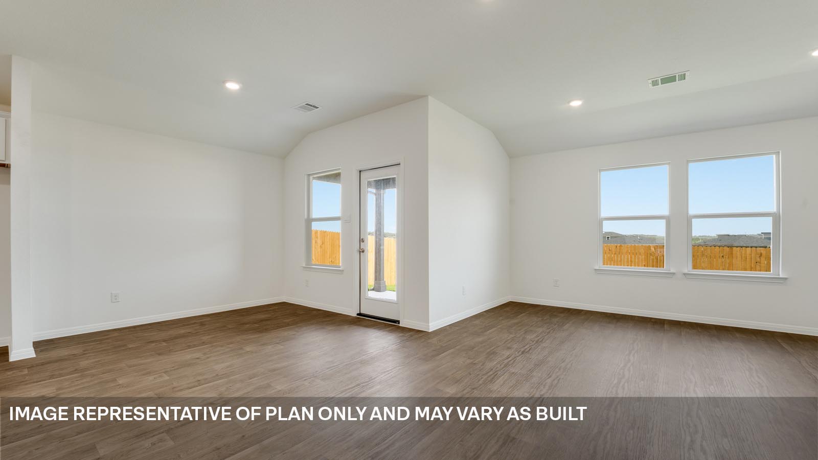 298 Mountain Pea Road Kyle, TX 78640 - Photo 8 of 21 an empty room with wooden floor and windows